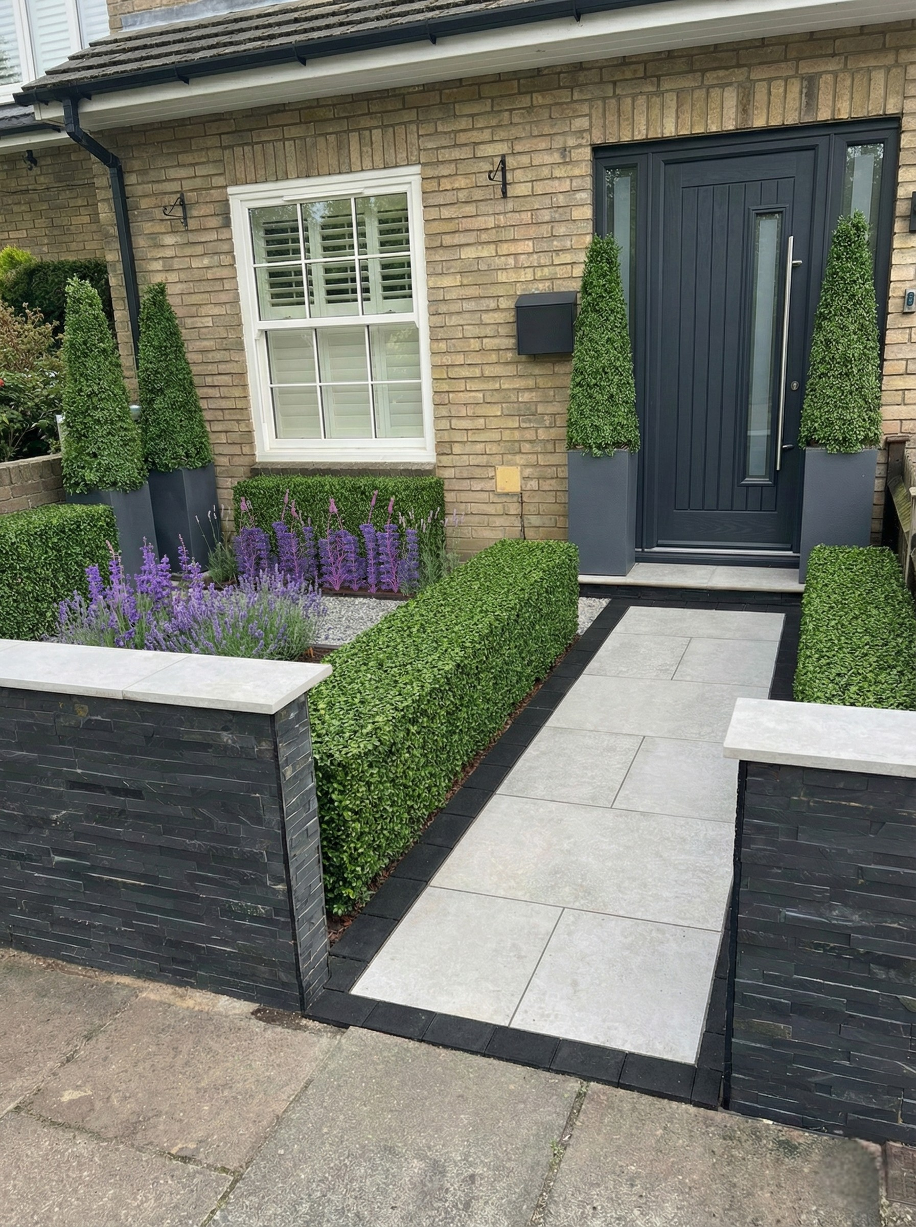 Front garden with porcelain path and coping